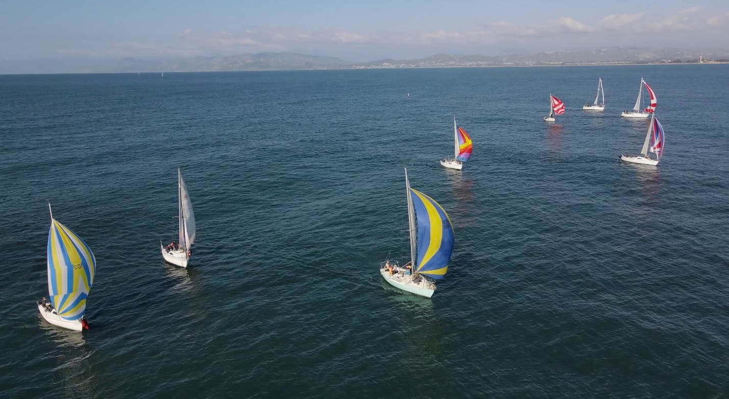 Fairwind boats flying colorful spinnakers off Channel Islands Harbor during the 2026 spinnaker sail